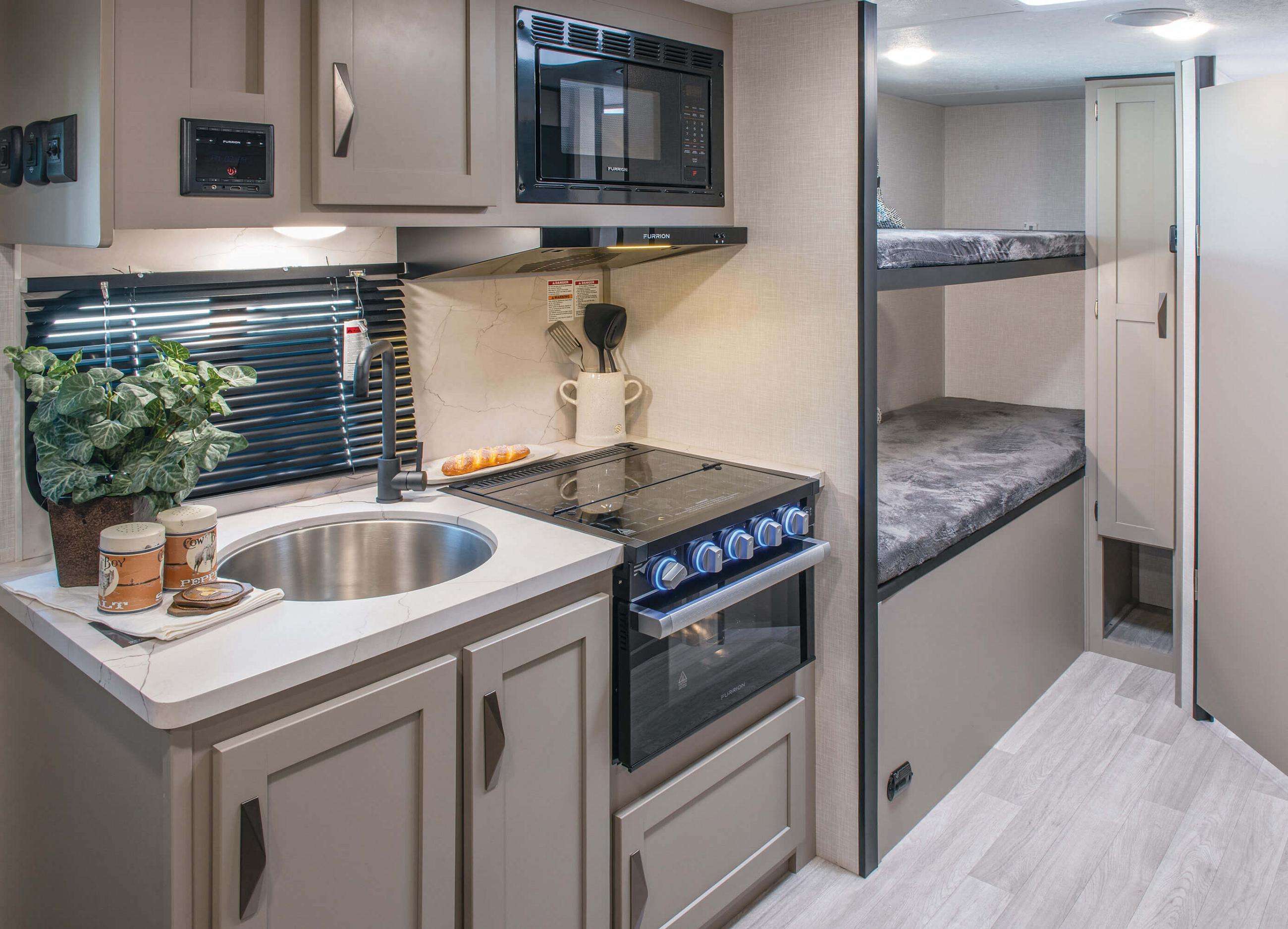 https://www.kz-rv.com/products/connect-mini-travel-trailers/images/2024/photos/CM191BHK/interior/2024-KZ-RV-Connect-Mini-CM191BHK-Travel-Trailer-Kitchen.jpg