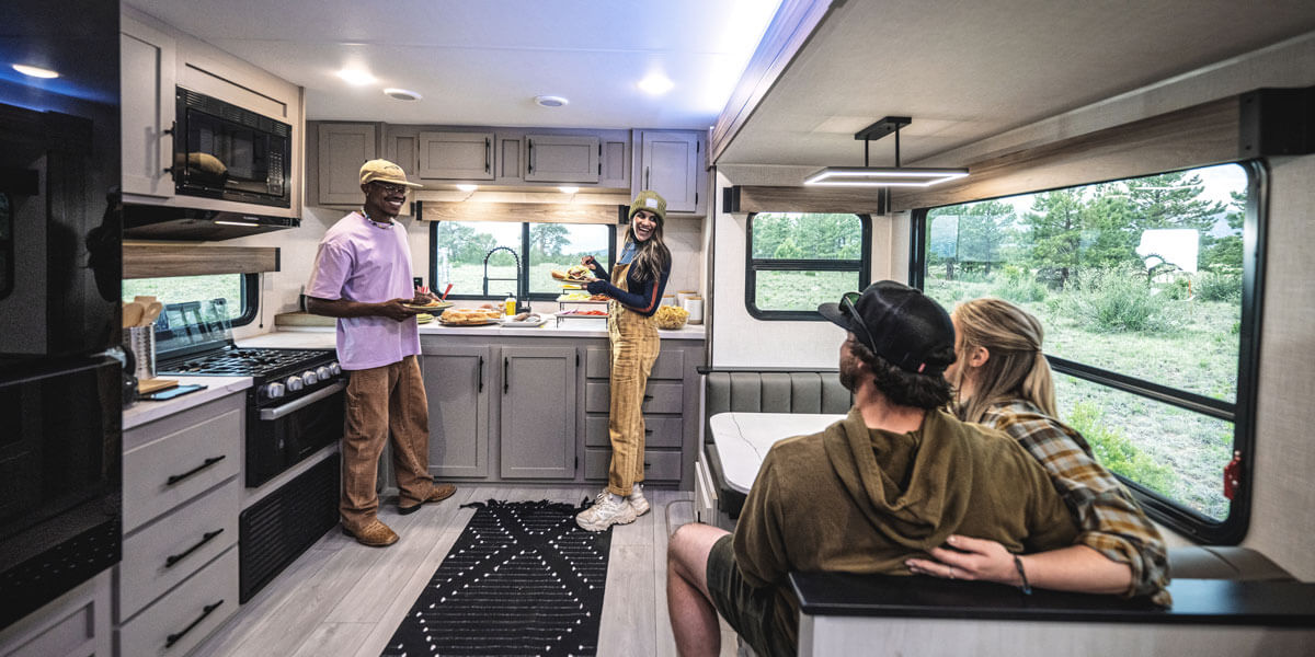 2025 KZ RV Connect C302FBK Travel Trailer with Friends in Kitchen